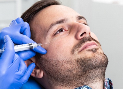 a person receiving BOTOX injections to address smile lines