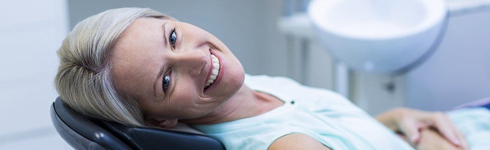 Smiling woman in dental chair