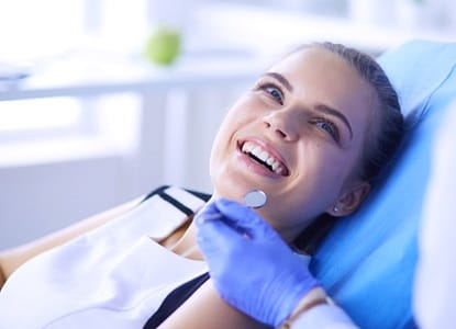 Woman receiving dental checkup