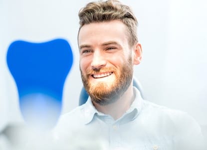 Smiling man at dental office