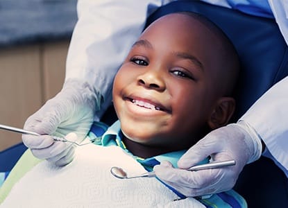 Smiling young boy in dental chair