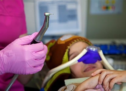Child with nitrous oxide nose mask