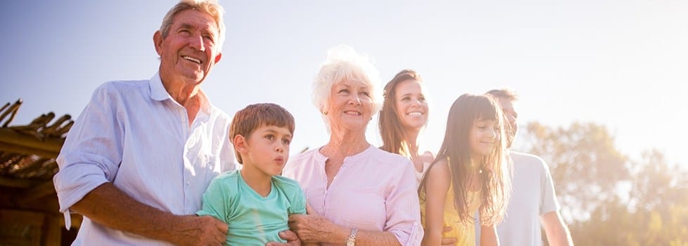 Three generations of family smiling together