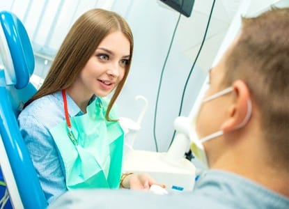 Young woman learning about emergency dentistry near Teays Valley.