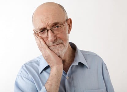 An older man with tooth pain.