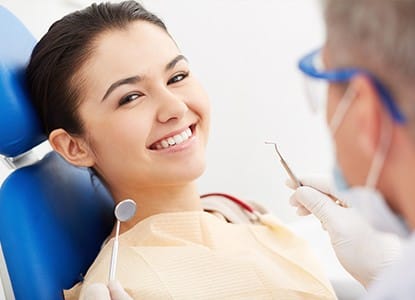 Smiling woman in dental chair