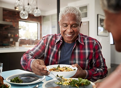 person eating dinner with family