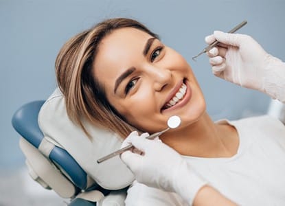 Happy woman enjoying dental services near Teays Valley